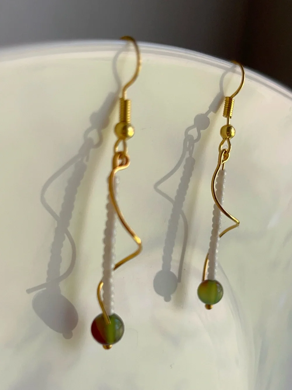 Dainty Drop Gold-toned Wavy Metal Design Adorned | White & Olive Grean Jade Bead
